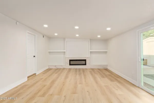 a view of a kitchen with a sink and a refrigerator