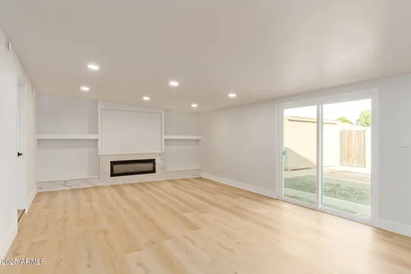 a view of an empty room with a window