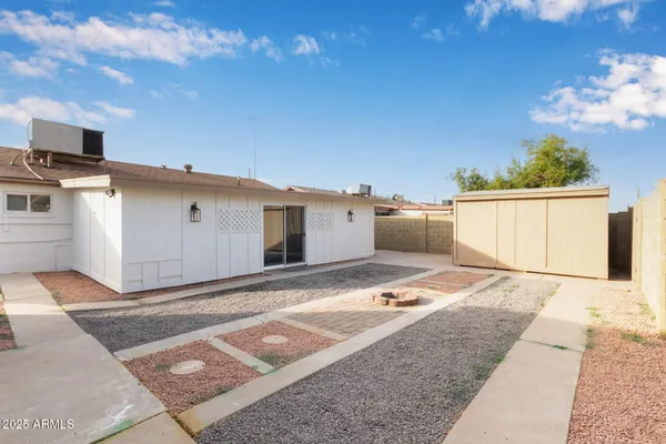 a view of a backyard of the house
