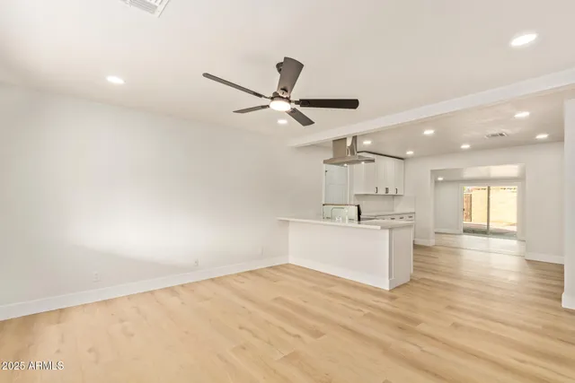 a view of kitchen with wooden floor and window