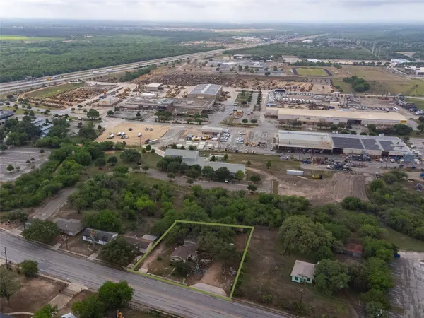 an aerial view of house with yard
