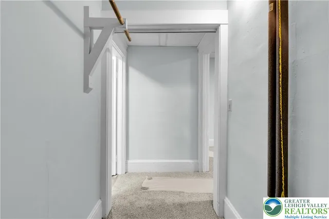 a kitchen with granite countertop a sink a stove and cabinets
