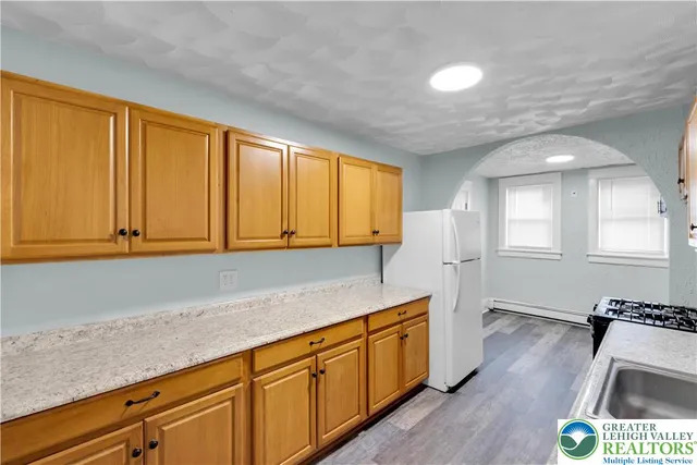 an empty room with a empty space and windows