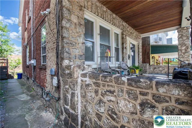 a front view of a house with next to a window