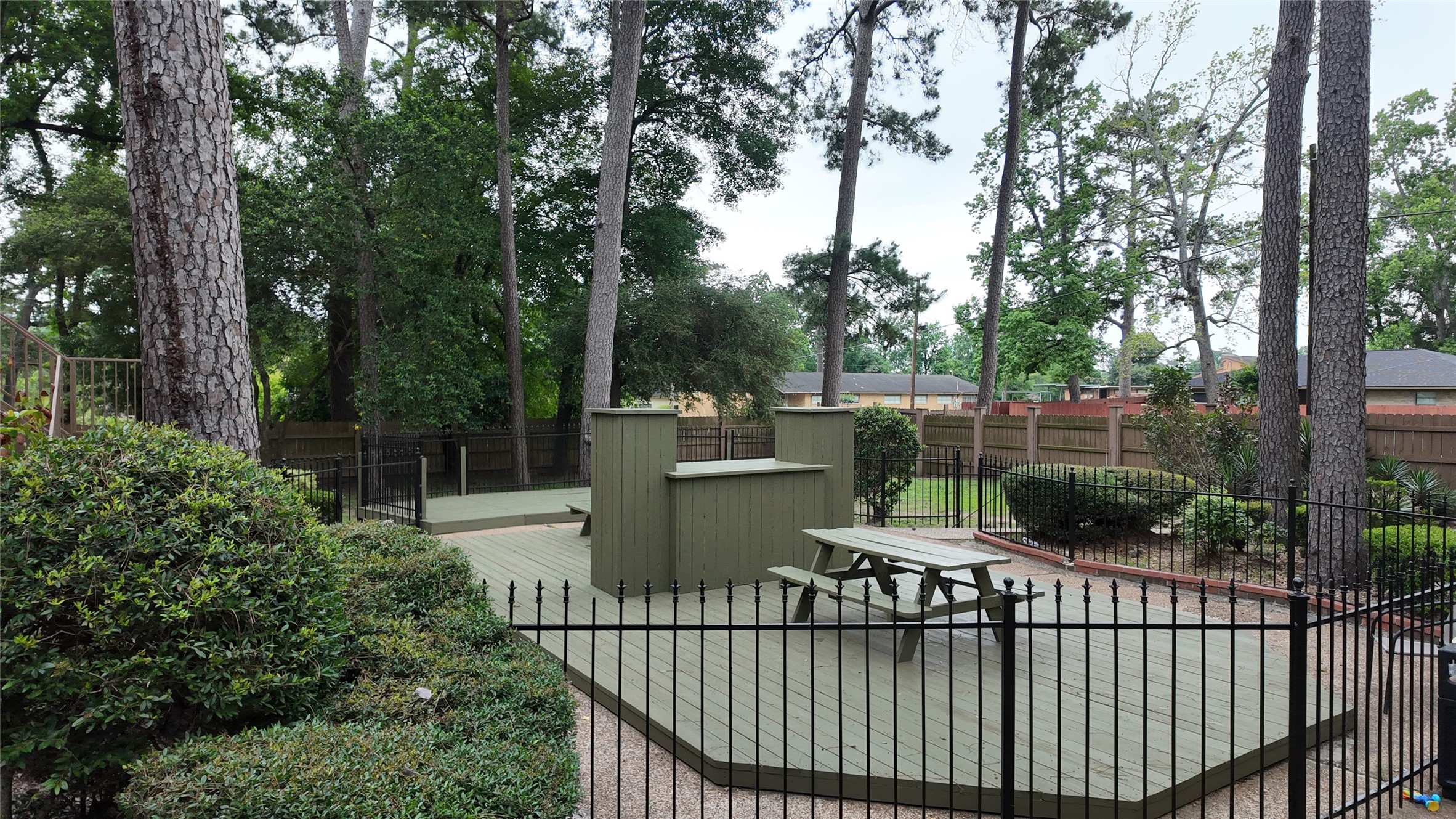 1510 Odd Fellow Street, Unit 21 Conroe, TX 77301 - Photo 6 of 7 a view of a balcony with trees