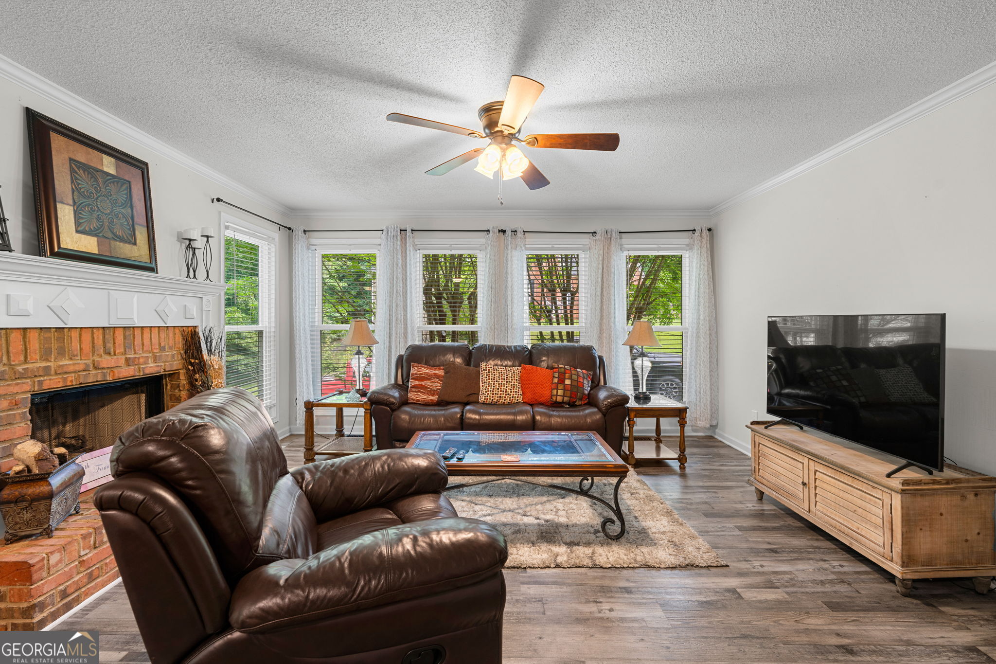 375 Gaelic Way Tyrone, GA 30290 - Photo 16 of 54 a living room with furniture and a flat screen tv