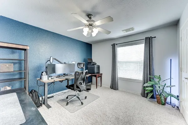 a workspace with furniture and a window