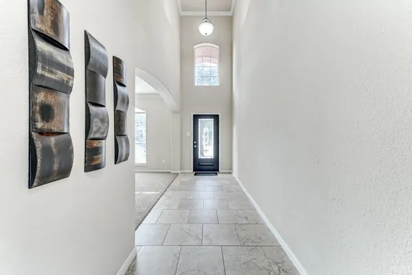 a view of an entryway with wooden floor and windows