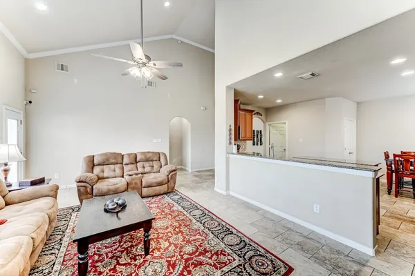 a living room with furniture and a rug