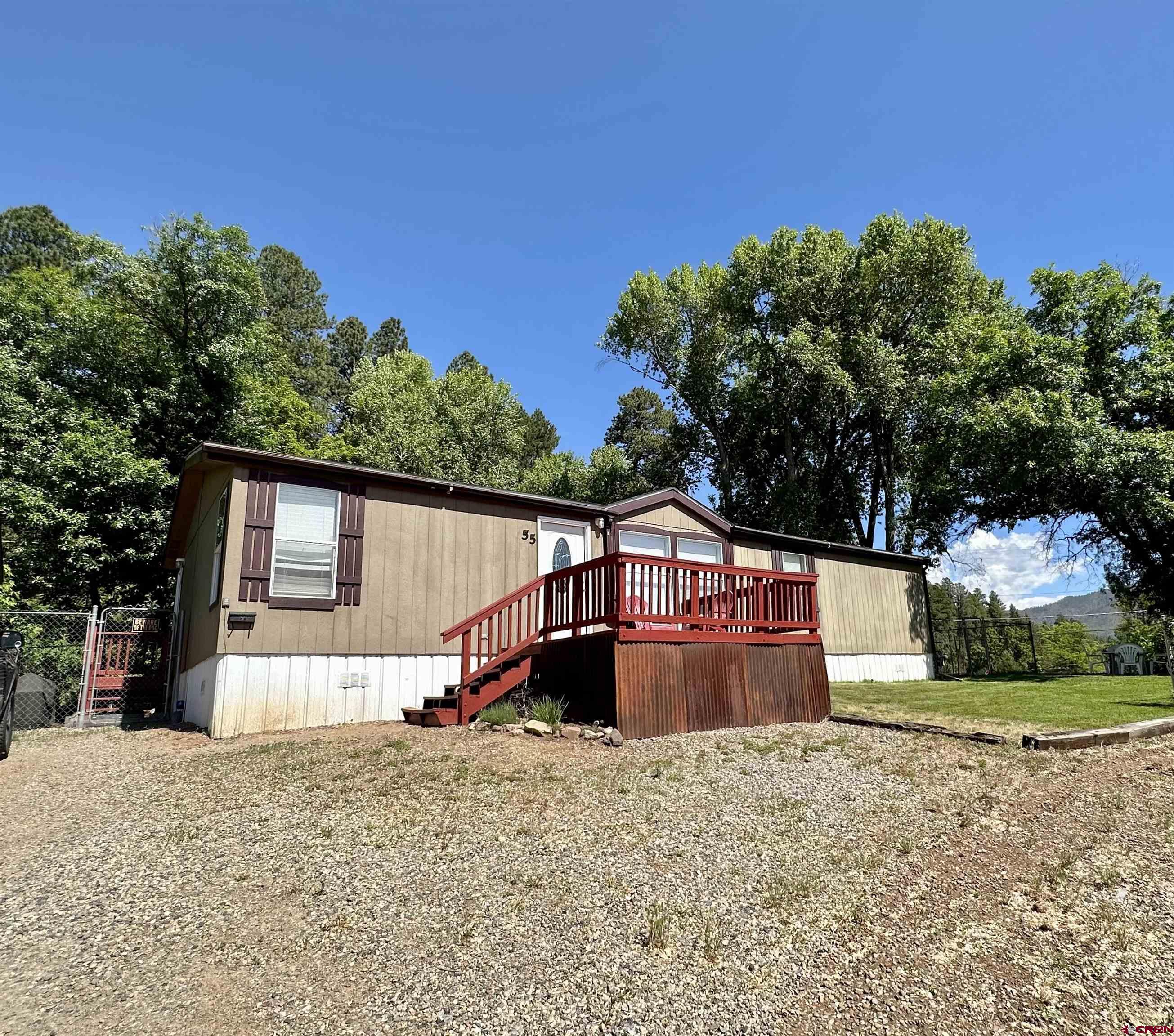 a house view with a backyard space