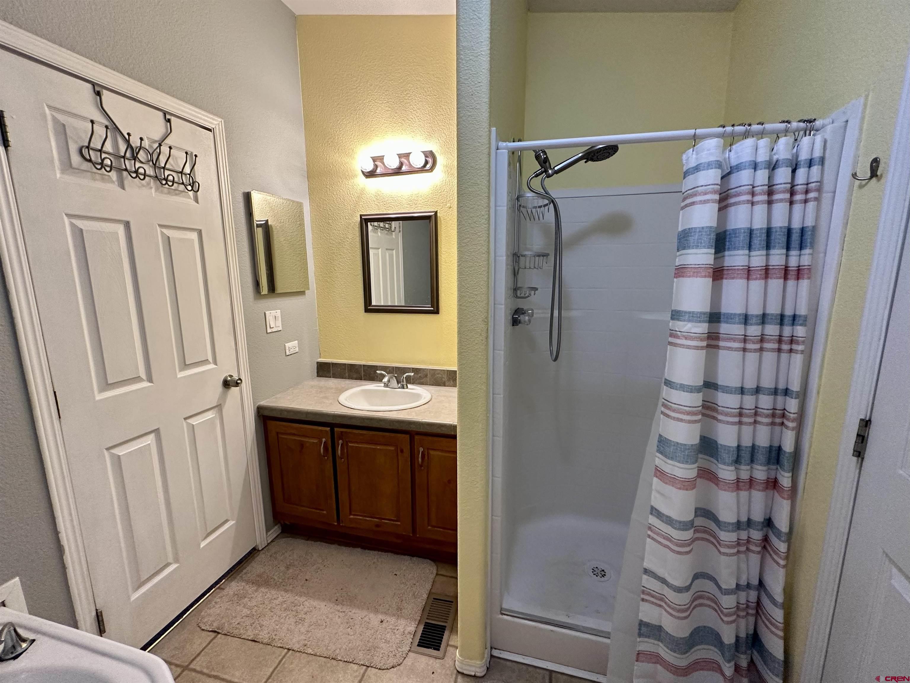 6000 County Road 203, Unit 55 Durango, CO 81301 - Photo 16 of 33 a bathroom with a shower and a sink