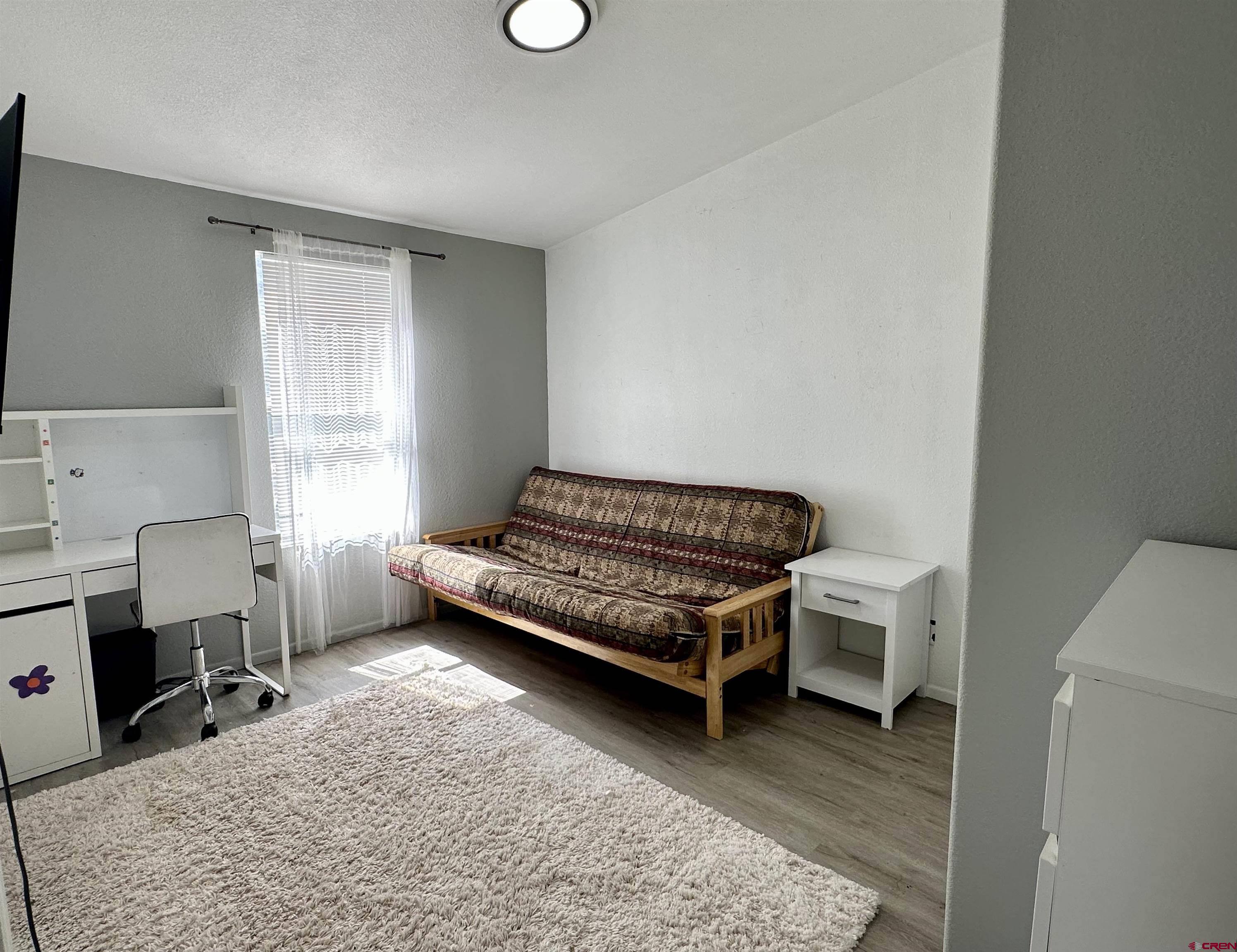 6000 County Road 203, Unit 55 Durango, CO 81301 - Photo 20 of 33 a bedroom with a bed and a window