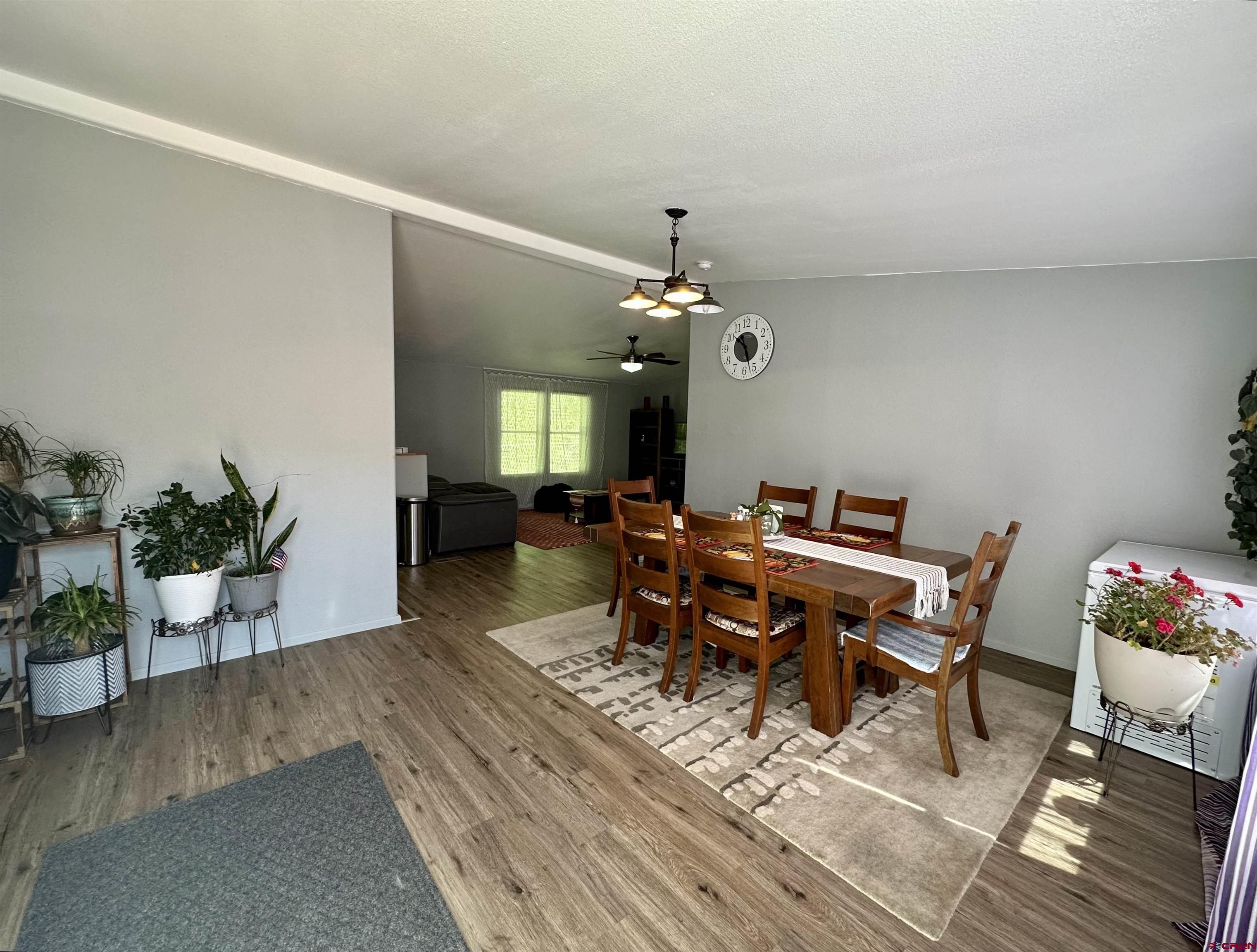 6000 County Road 203, Unit 55 Durango, CO 81301 - Photo 2 of 33 a view of a dining room with furniture and wooden floor