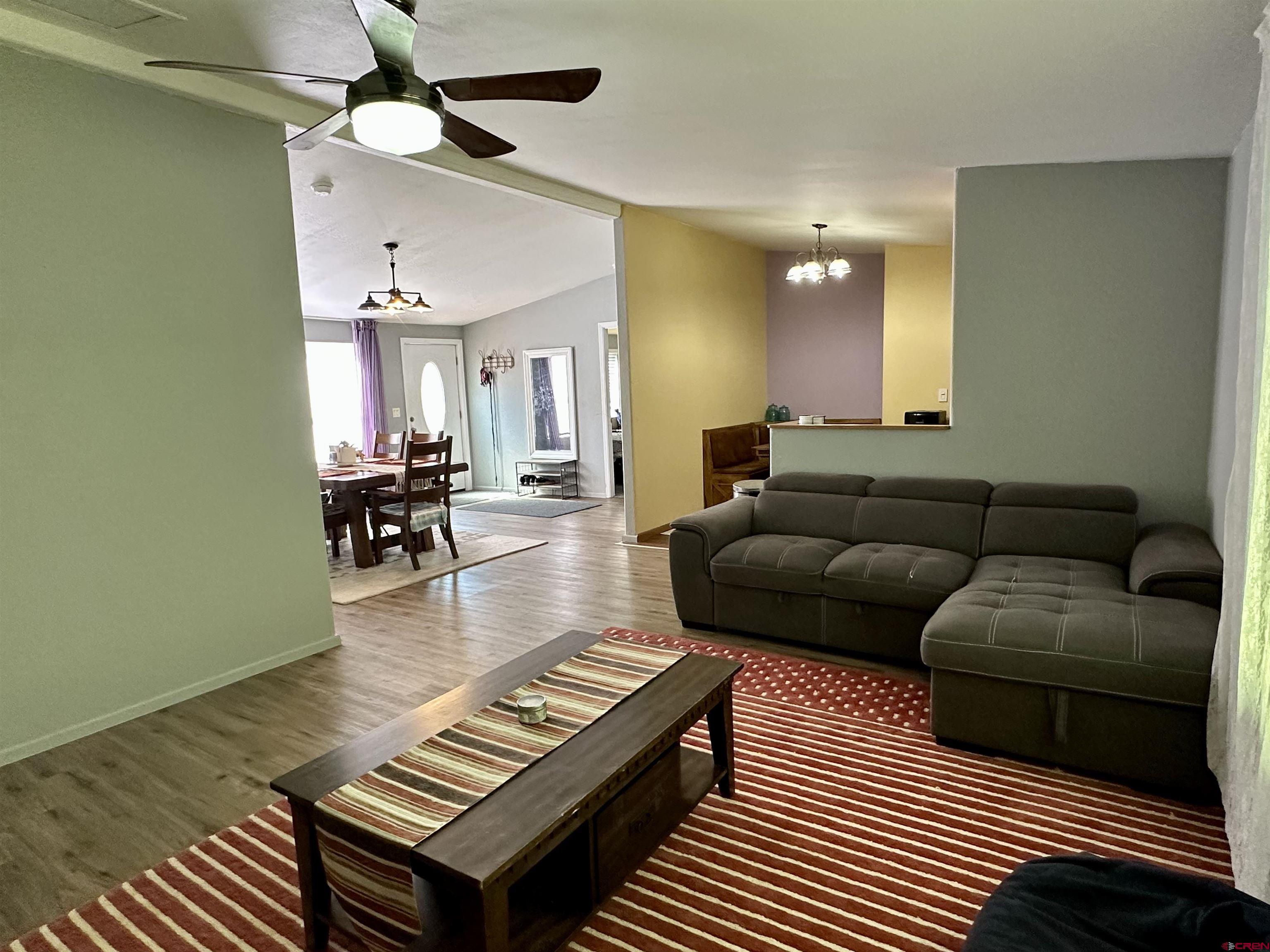 6000 County Road 203, Unit 55 Durango, CO 81301 - Photo 25 of 33 a living room with furniture a rug and a piano