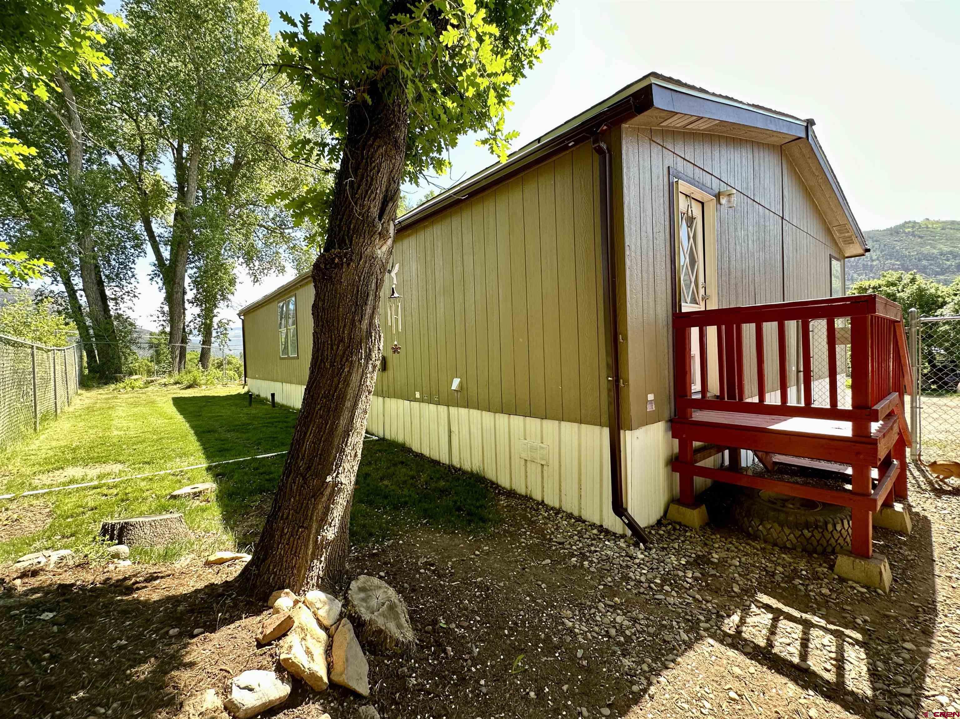 6000 County Road 203, Unit 55 Durango, CO 81301 - Photo 30 of 33 a view of a backyard with a small cabin
