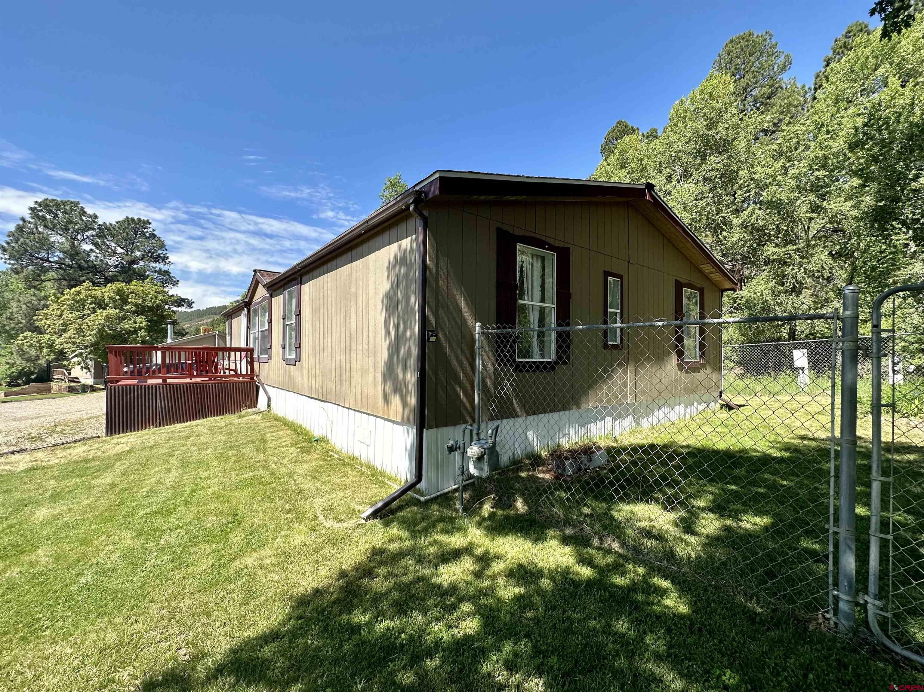 6000 County Road 203, Unit 55 Durango, CO 81301 - Photo 32 of 33 a backyard of a house with yard and outdoor seating