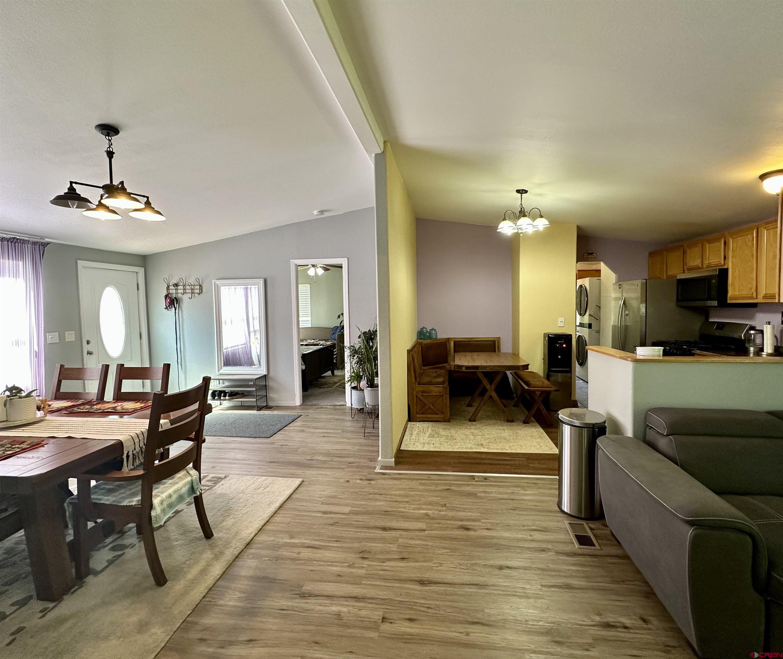 6000 County Road 203, Unit 55 Durango, CO 81301 - Photo 5 of 33 a living room with furniture a dining table and chairs