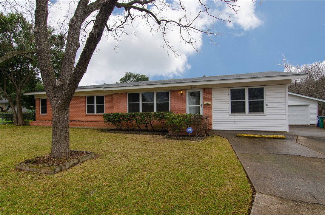 6900 Daugherty Street Austin, TX 78757 - Photo 1 of 1 a front view of a house with a yard