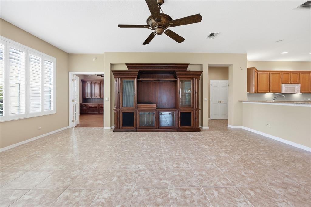 9029 Southeast 130th Loop Summerfield, FL 34491 - Photo 22 of 55 an empty room with windows and cabinet