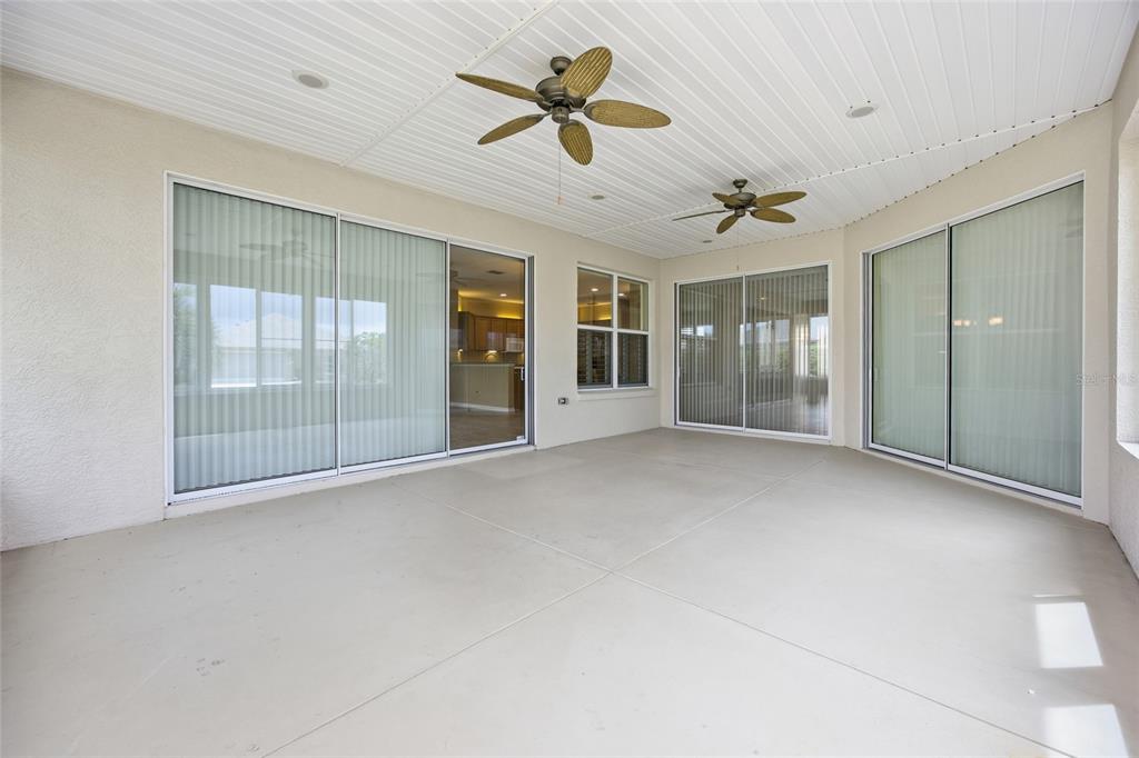 9029 Southeast 130th Loop Summerfield, FL 34491 - Photo 26 of 55 a view of an empty room with a ceiling fan and window