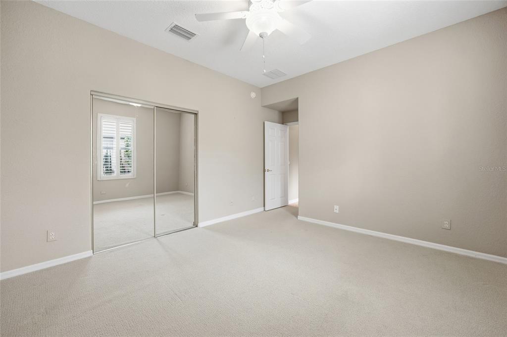9029 Southeast 130th Loop Summerfield, FL 34491 - Photo 34 of 55 an empty room with fan and windows