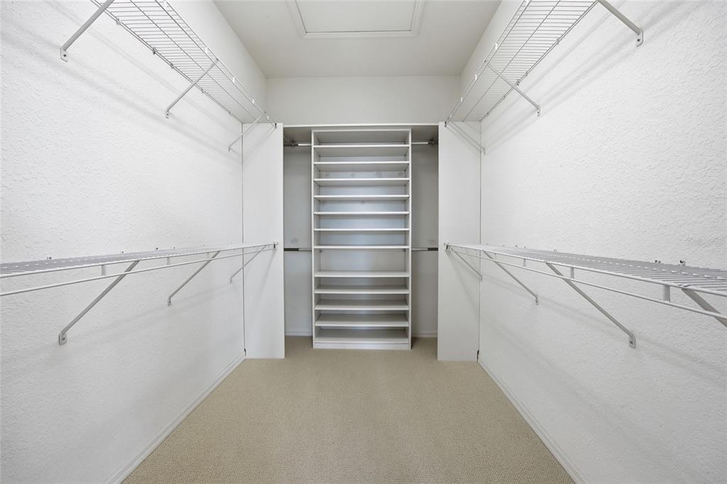 9029 Southeast 130th Loop Summerfield, FL 34491 - Photo 40 of 55 a view of walk in closet with empty racks