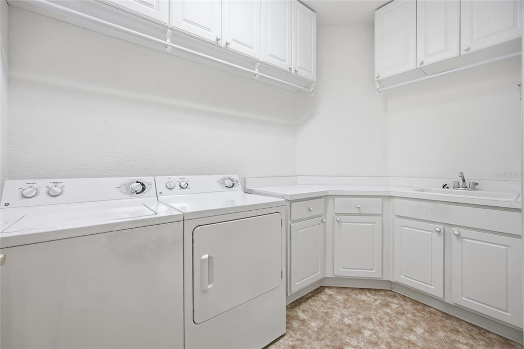 9029 Southeast 130th Loop Summerfield, FL 34491 - Photo 41 of 55 a utility room with dryer and washer