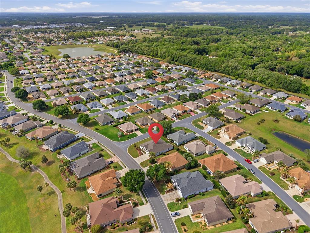 9029 Southeast 130th Loop Summerfield, FL 34491 - Photo 52 of 55 an aerial view of a city with lots of residential buildings