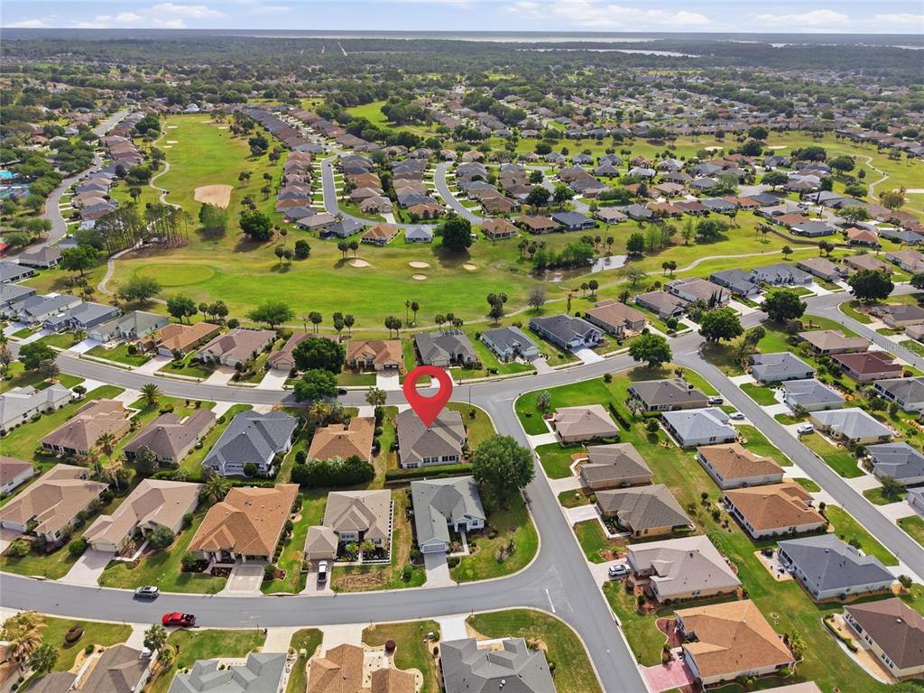 9029 Southeast 130th Loop Summerfield, FL 34491 - Photo 53 of 55 an aerial view of residential houses with outdoor space and swimming pool
