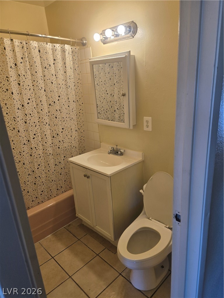 1388 East Desert Inn Road, Unit 2 Las Vegas, NV 89169 - Photo 6 of 23 Functional bathroom with tiled flooring and a convenient vanity provides essential amenities.