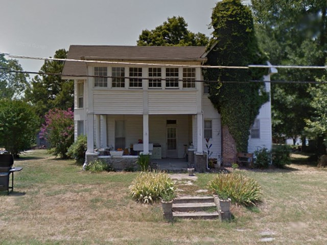117 South Main Street Humboldt, TN 38343 - Photo 1 of 1 a front view of a house with garden