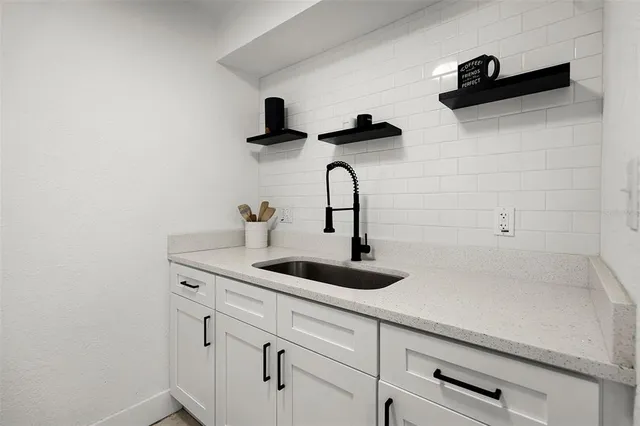 a close view of a sink and a vanity in the bathroom