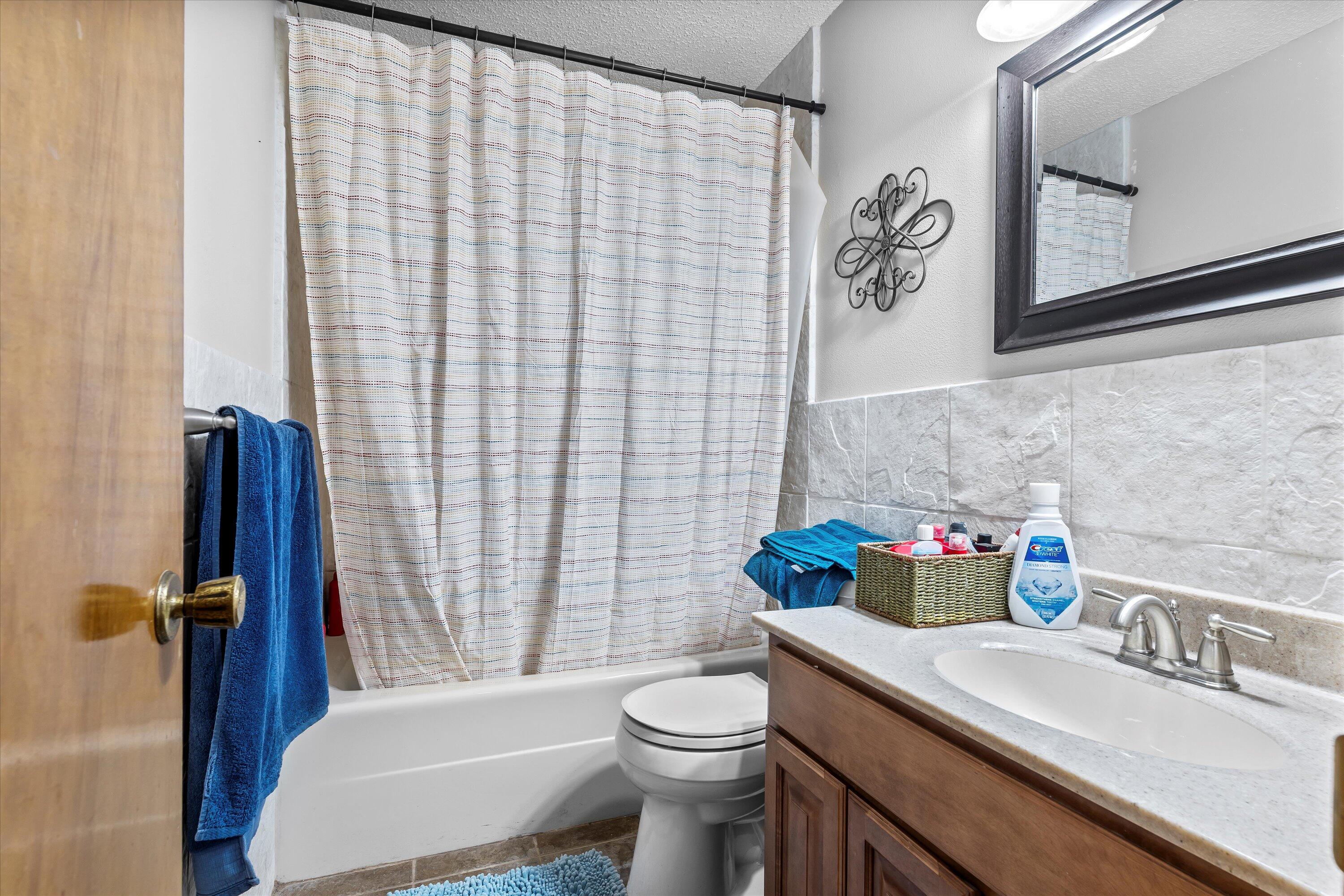 116 East 26th Street Littlefield, TX 79339 - Photo 25 of 40 a bathroom with a sink toilet and shower
