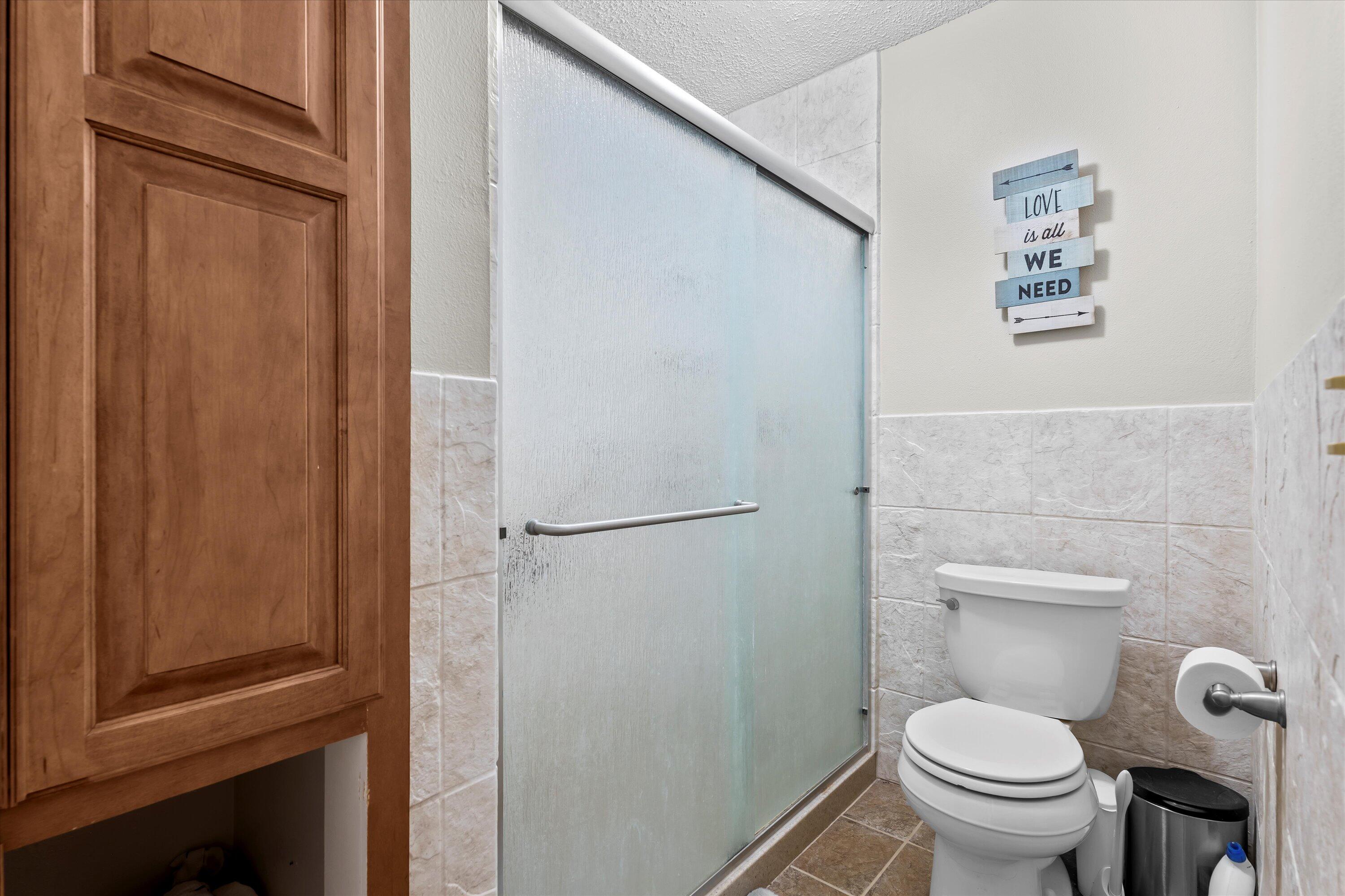 116 East 26th Street Littlefield, TX 79339 - Photo 31 of 40 a white toilet sitting next to a shower