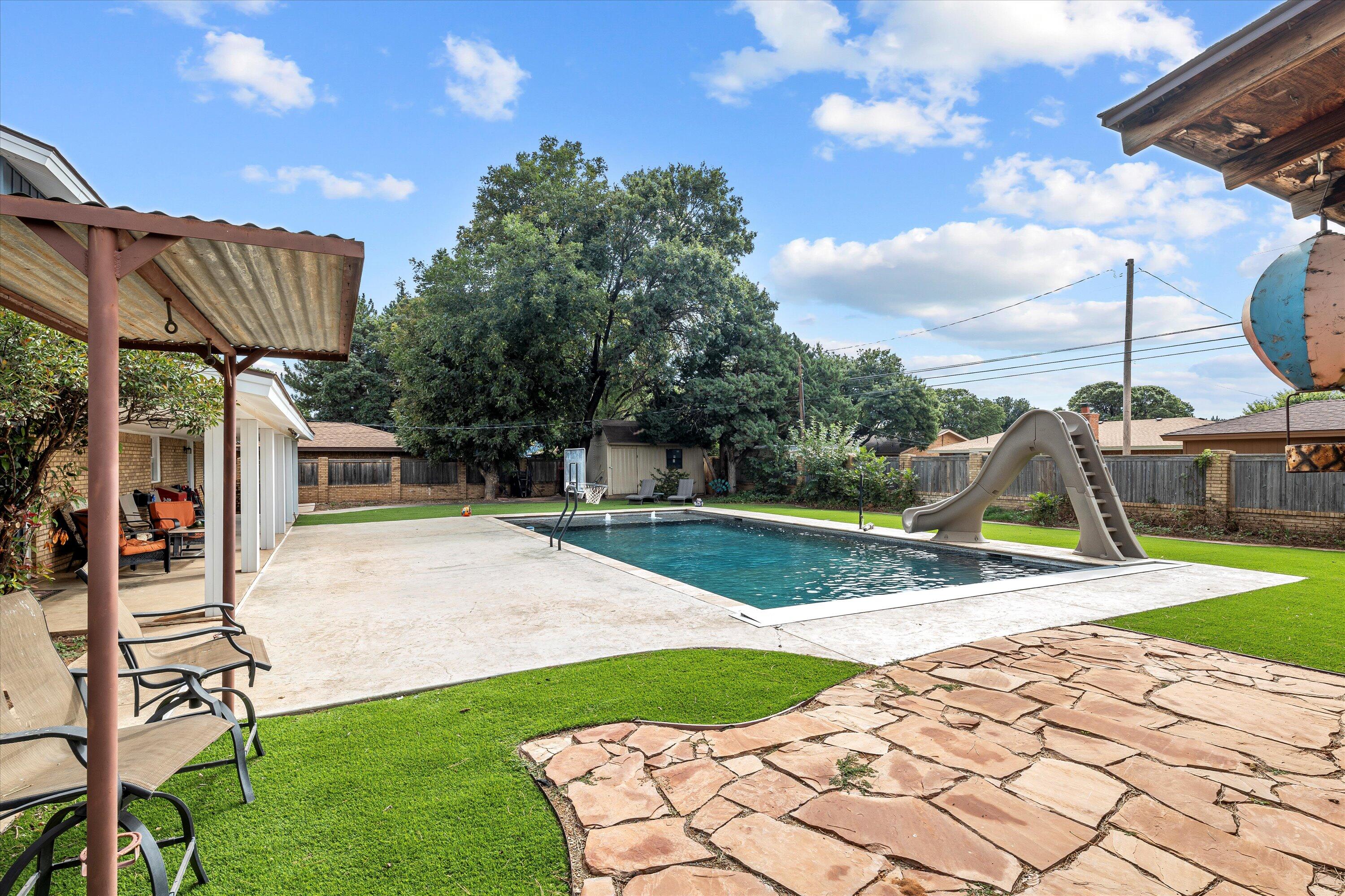 116 East 26th Street Littlefield, TX 79339 - Photo 5 of 40 a view of a backyard with a slide