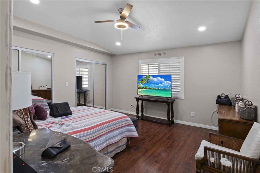 14980 Pendleton Street Hesperia, CA 92345 - Photo 13 of 27 a bedroom with a bed and a flat screen tv