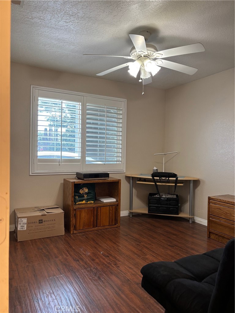 14980 Pendleton Street Hesperia, CA 92345 - Photo 18 of 27 a living room with furniture and wooden floor
