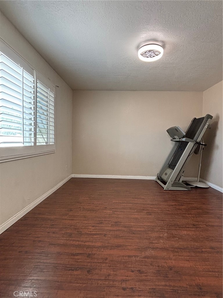 14980 Pendleton Street Hesperia, CA 92345 - Photo 22 of 27 wooden floor in an empty room with a window