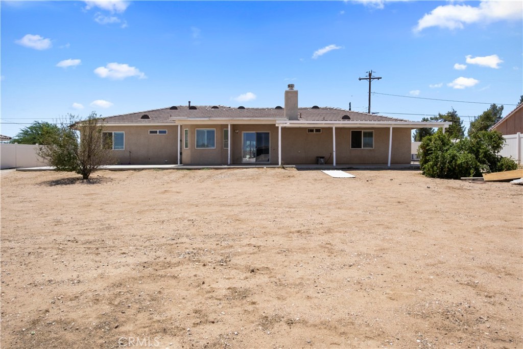 14980 Pendleton Street Hesperia, CA 92345 - Photo 26 of 27 a large white house with a large space in front of it