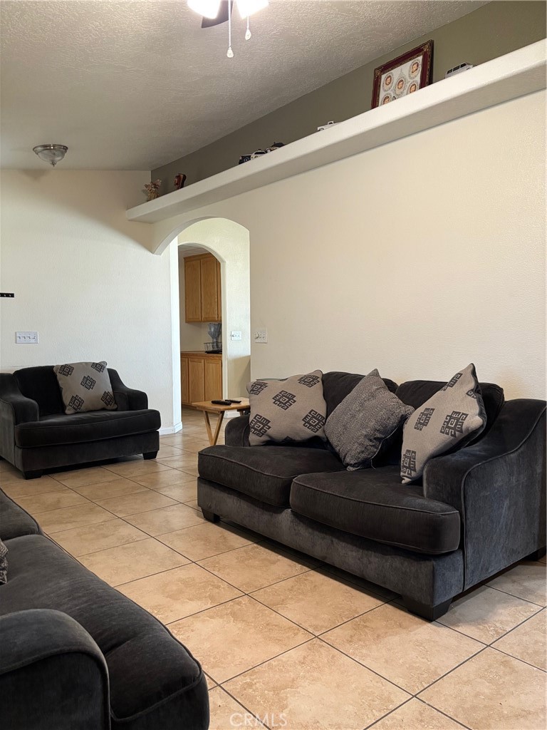 14980 Pendleton Street Hesperia, CA 92345 - Photo 6 of 27 a living room with furniture and a couch