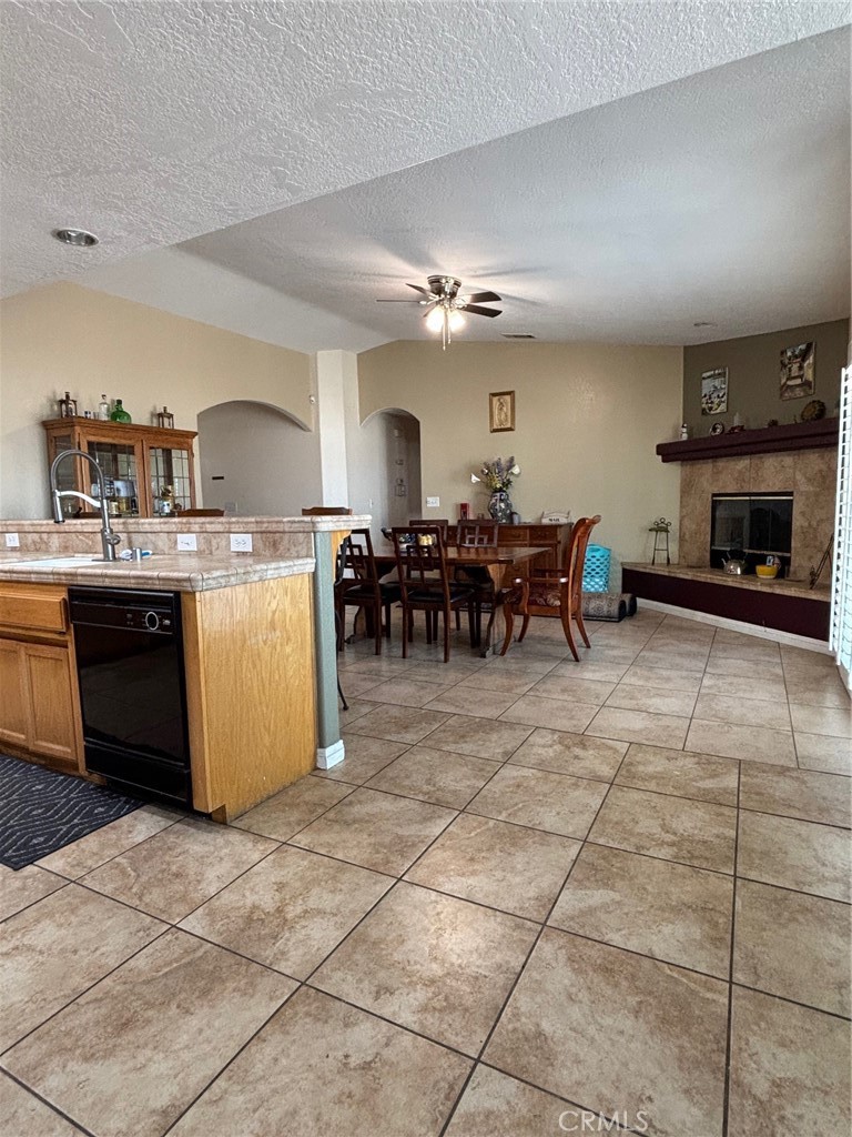 14980 Pendleton Street Hesperia, CA 92345 - Photo 9 of 27 a living room with fireplace furniture and a fireplace