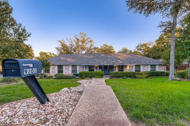 a front view of a house with yard