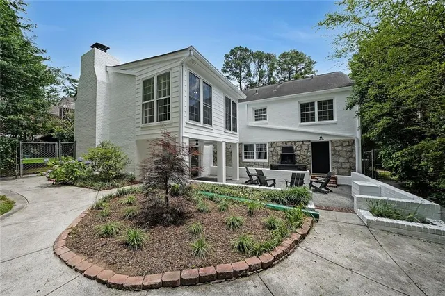 a view of a house with outdoor kitchen