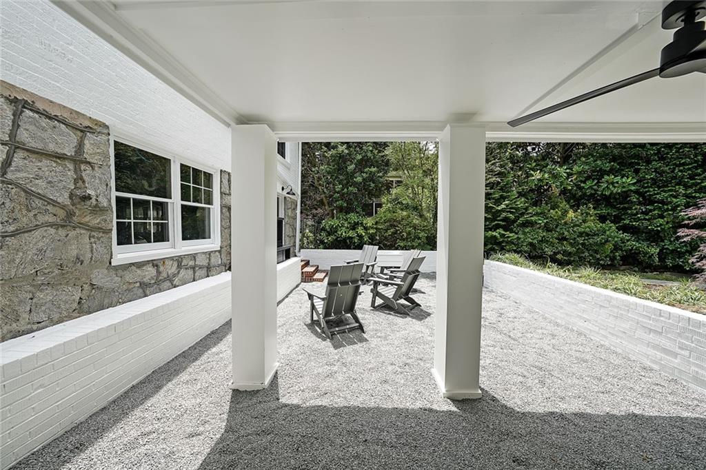167 Garden Lane Decatur, GA 30030 - Photo 17 of 18 a view of a patio with table and chairs with wooden floor and fence