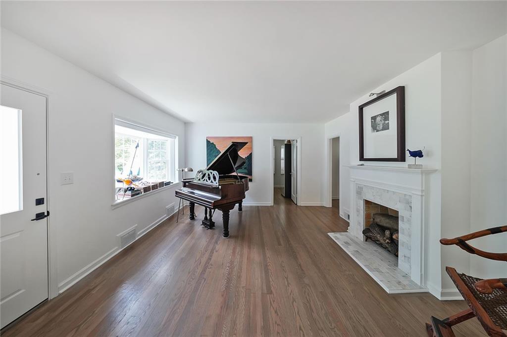 167 Garden Lane Decatur, GA 30030 - Photo 8 of 18 a living room with furniture and a fireplace