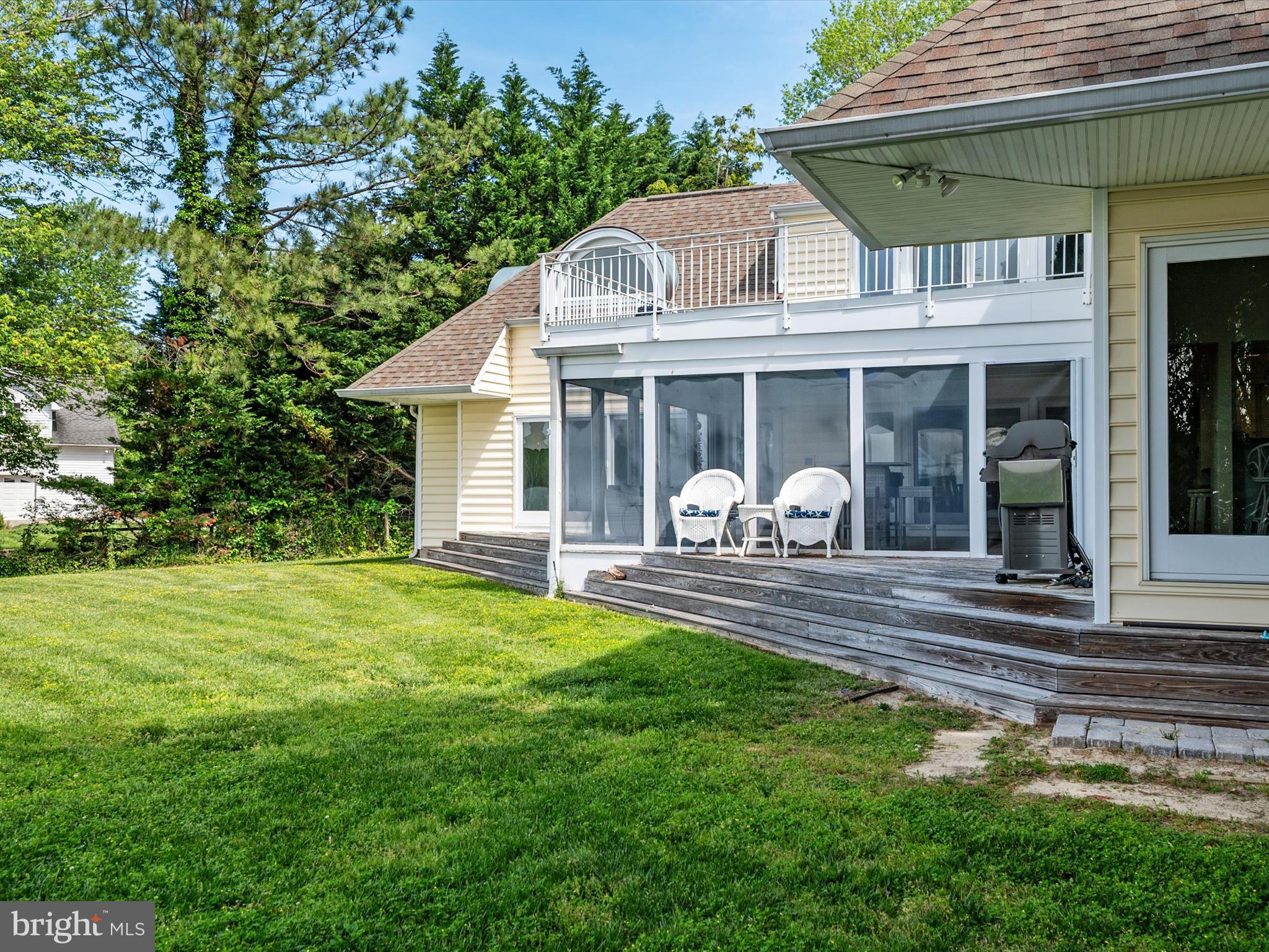 1601 Cliff Drive Edgewater, MD 21037 - Photo 11 of 86 a front view of a house with a yard porch and outdoor seating