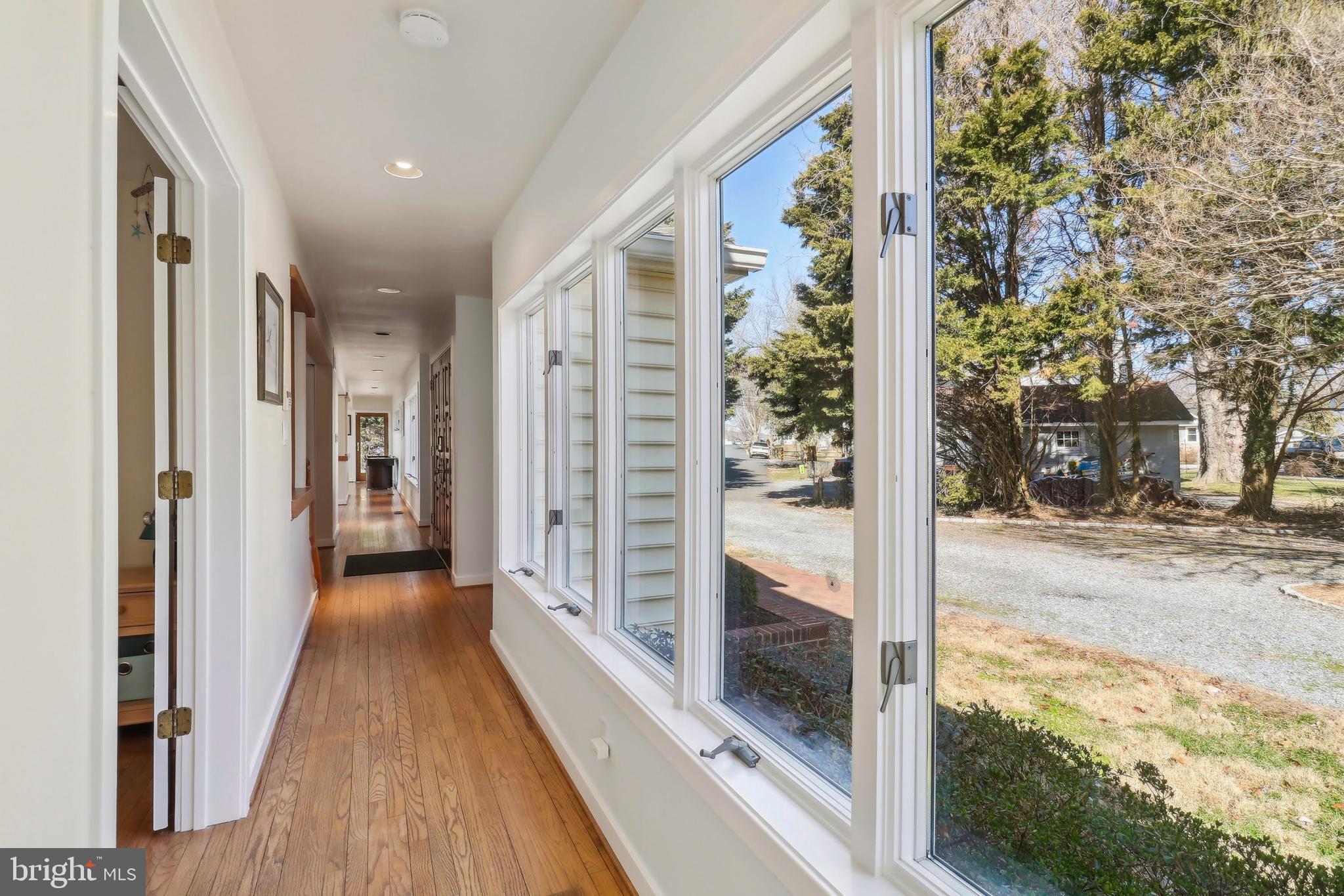 1601 Cliff Drive Edgewater, MD 21037 - Photo 25 of 86 a view of a porch with wooden floor and floor to ceiling window