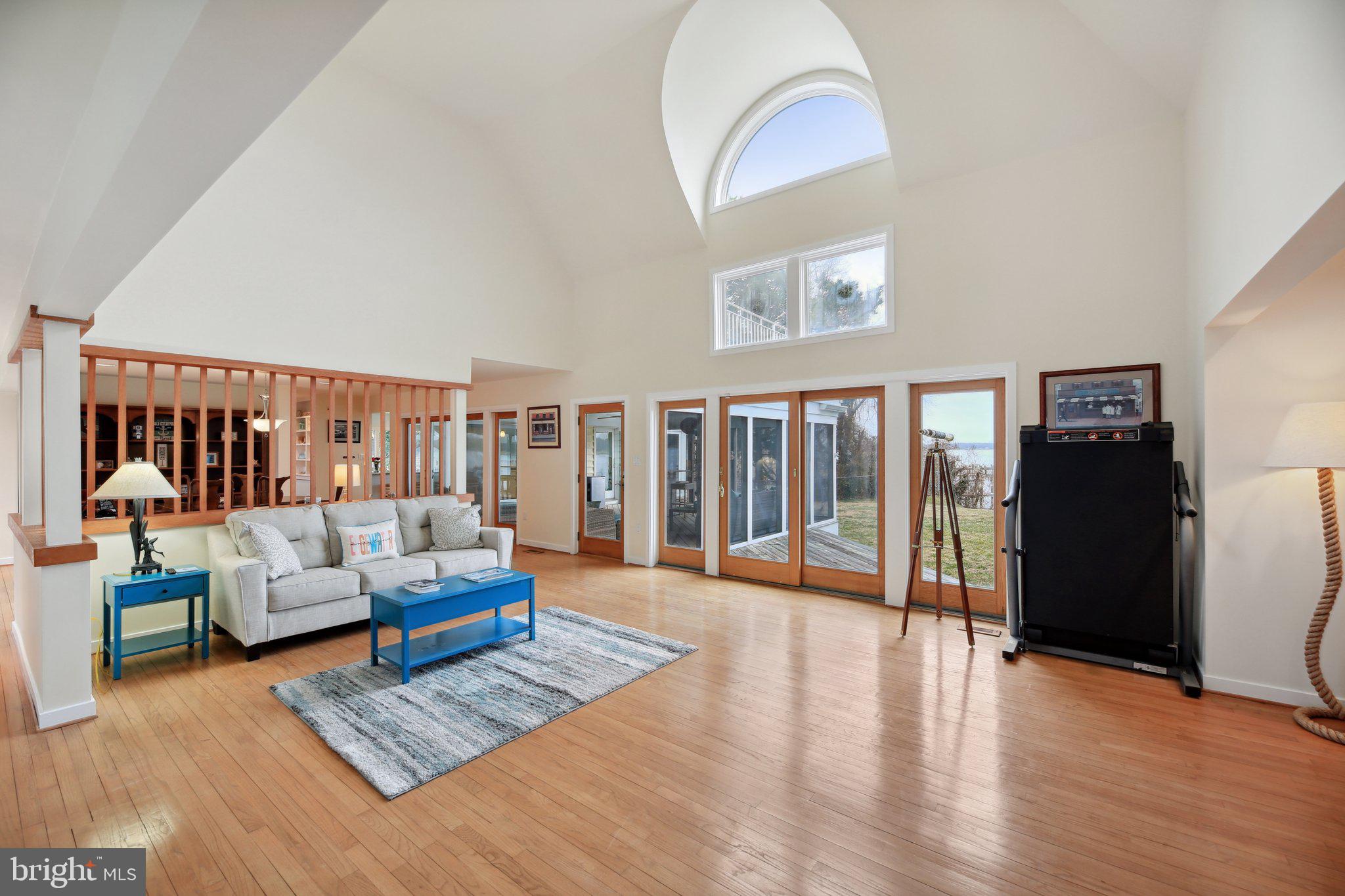 1601 Cliff Drive Edgewater, MD 21037 - Photo 27 of 86 a living room with furniture and a floor to ceiling window