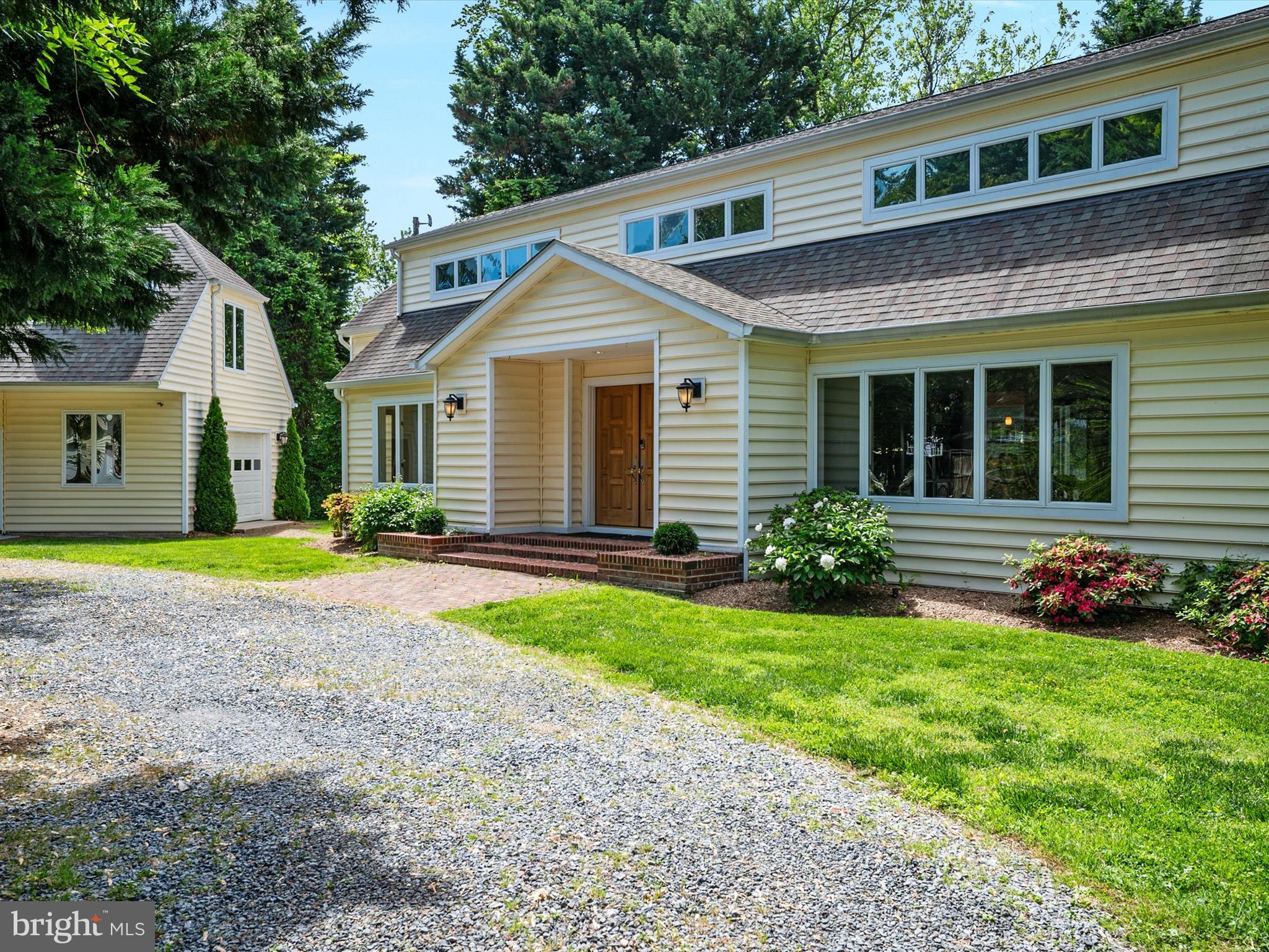 1601 Cliff Drive Edgewater, MD 21037 - Photo 3 of 86 a view of a house with a yard and plants