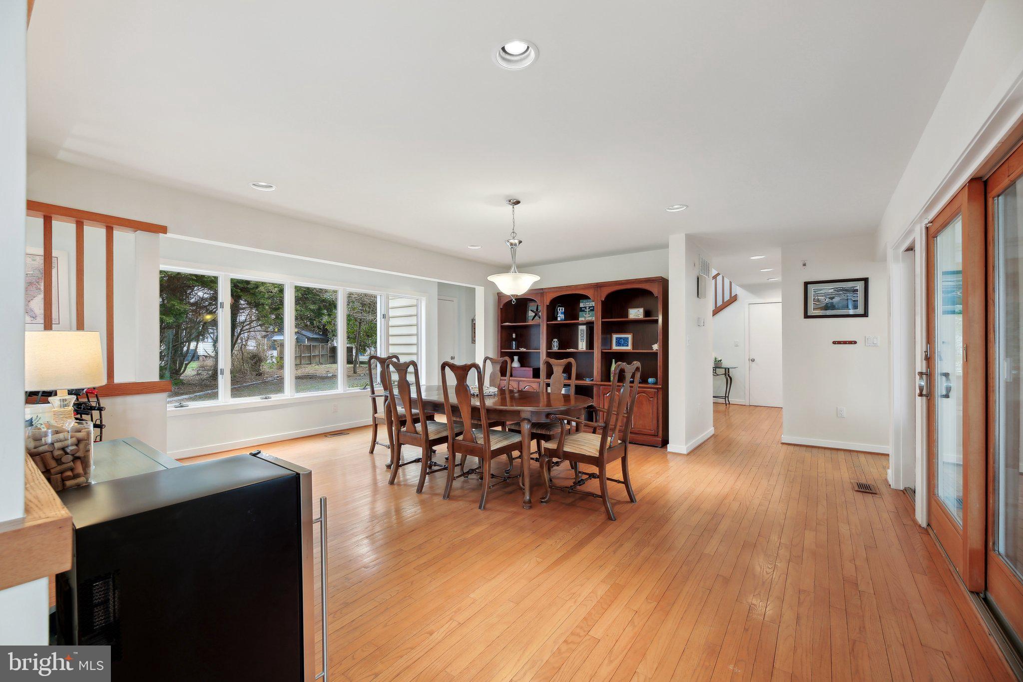 1601 Cliff Drive Edgewater, MD 21037 - Photo 31 of 86 a view of a dining room with furniture window and wooden floor